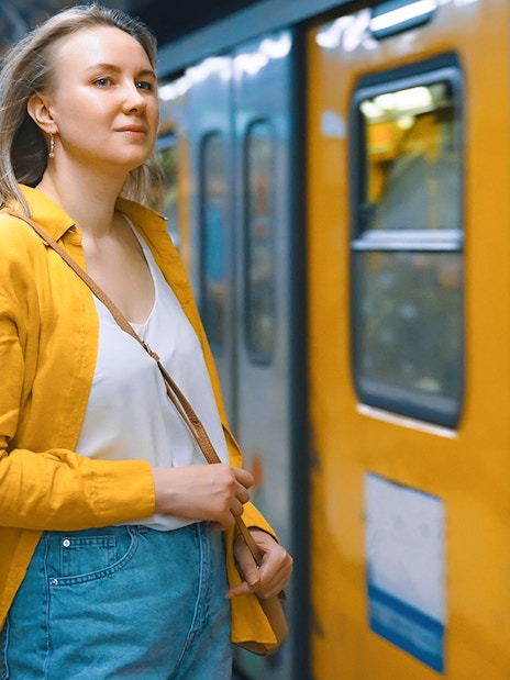 Person waiting for Campania Express train transfer between Naples and Sorrento.