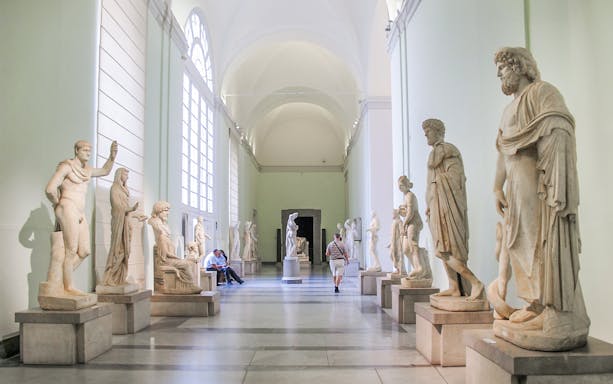 Statues in a gallery at the National Archaeological Museum, Naples.