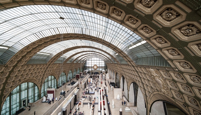 Tourists exploring art at the Orsay Museum in Paris, available with Fast-Track Tickets.