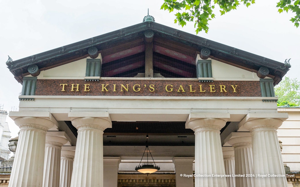 Entrance to The King's Gallery at Buckingham Palace with columns and signage.