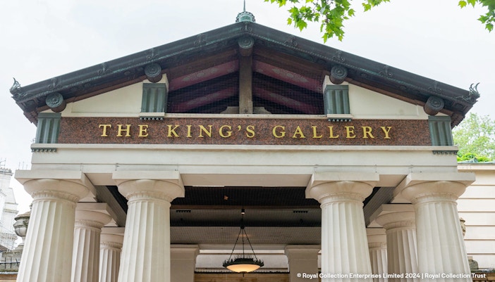 Entrance to The King's Gallery at Buckingham Palace with columns and signage.