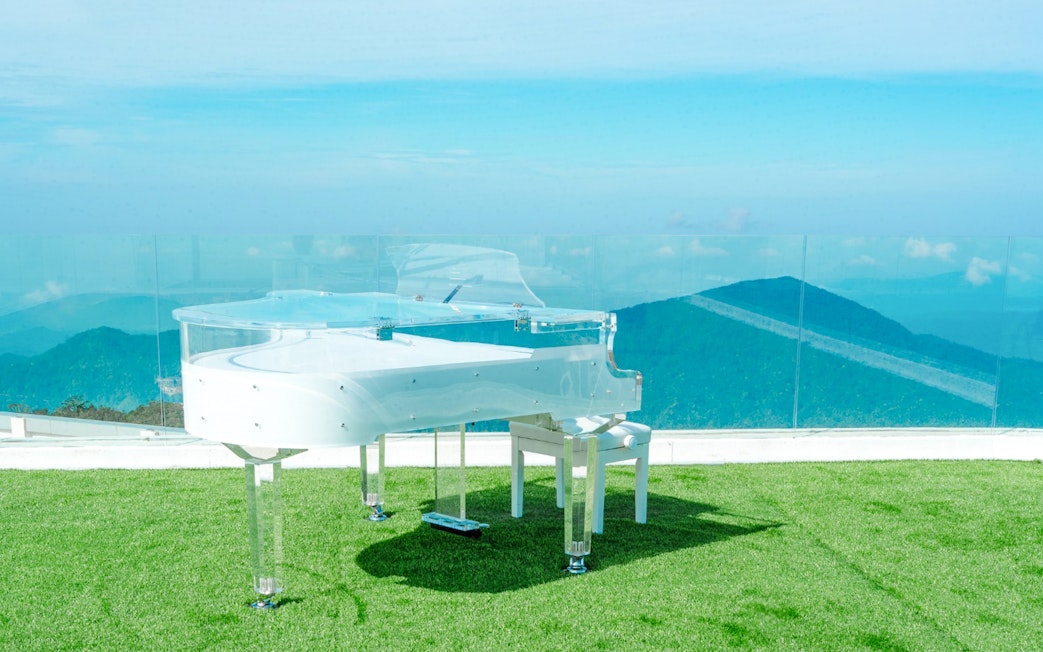 Transparent piano on a grassy terrace at Hoverland, Wyndham Ion Majestic Hotel, Genting Highlands.
