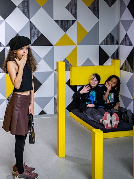 Visitors exploring interactive exhibit at Paradox Museum.