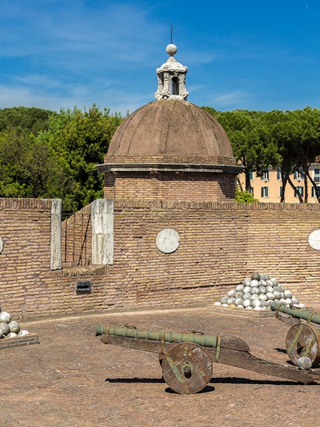 Cannons and cannonballs at Castel Sant'Angelo military exhibits in Rome.