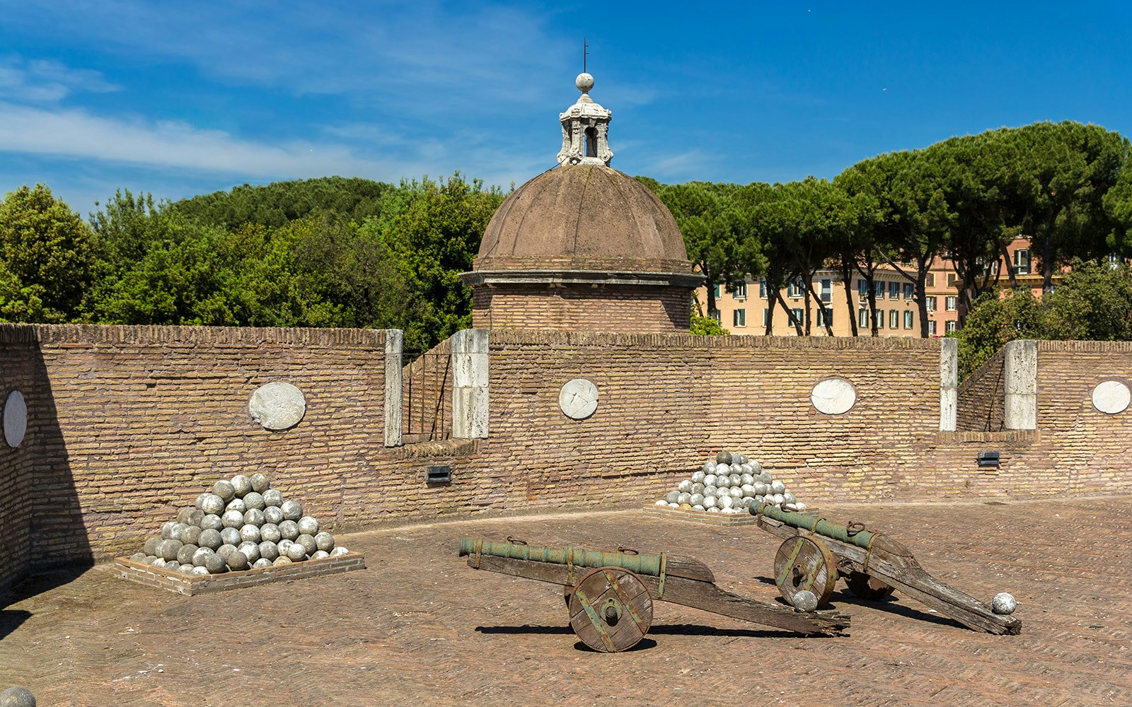 Cannons and cannonballs at Castel Sant'Angelo military exhibits in Rome.