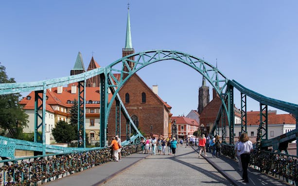 Tumski Bridge with tourists in Wroclaw during small-group tour from Warsaw.
