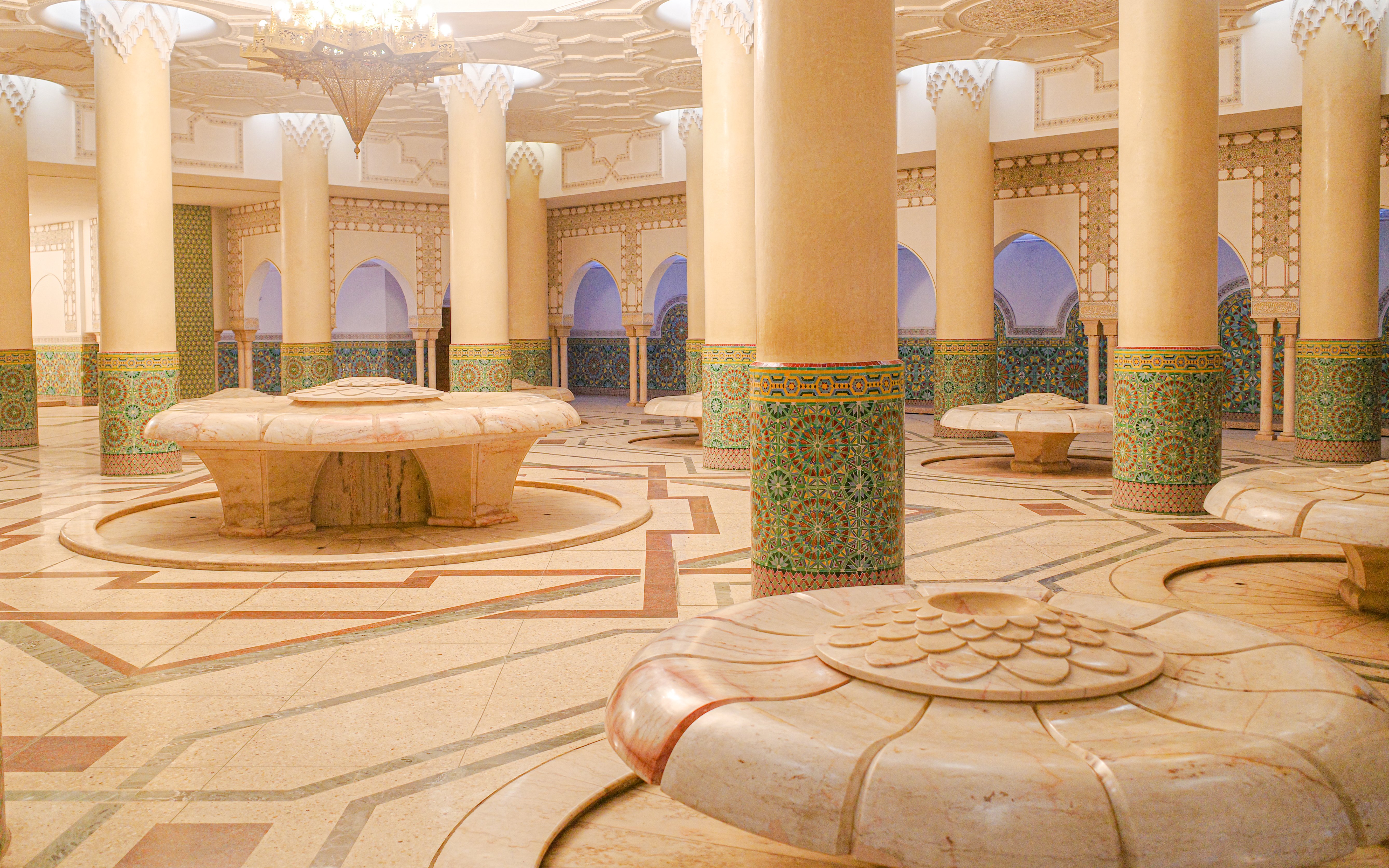 Hassan II Mosque interior with ornate columns and intricate tilework, Casablanca, Morocco.