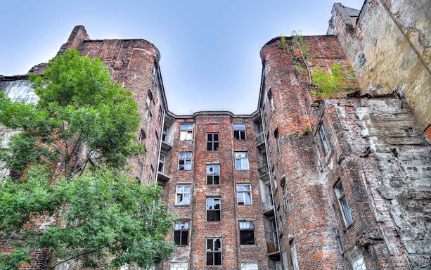 Historic brick building in Warsaw's Jewish district on a private walking tour.