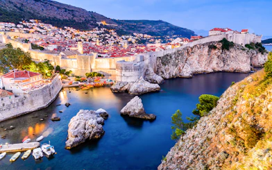 Dubrovnik city walls and coastline at sunset, Croatia.