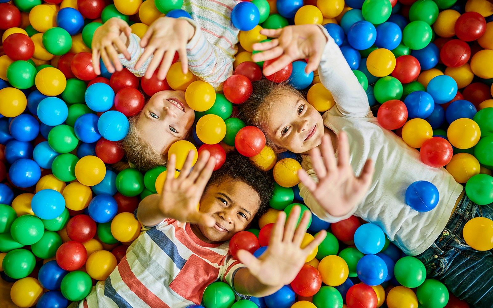 children playing in games room at kidzania dubai