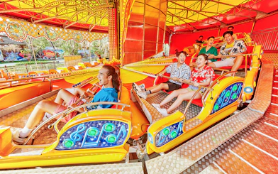 Visitors enjoying a colorful ride at VinWonders Phu Quoc.
