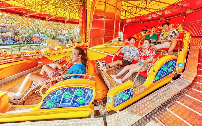 Visitors enjoying a colorful ride at VinWonders Phu Quoc.
