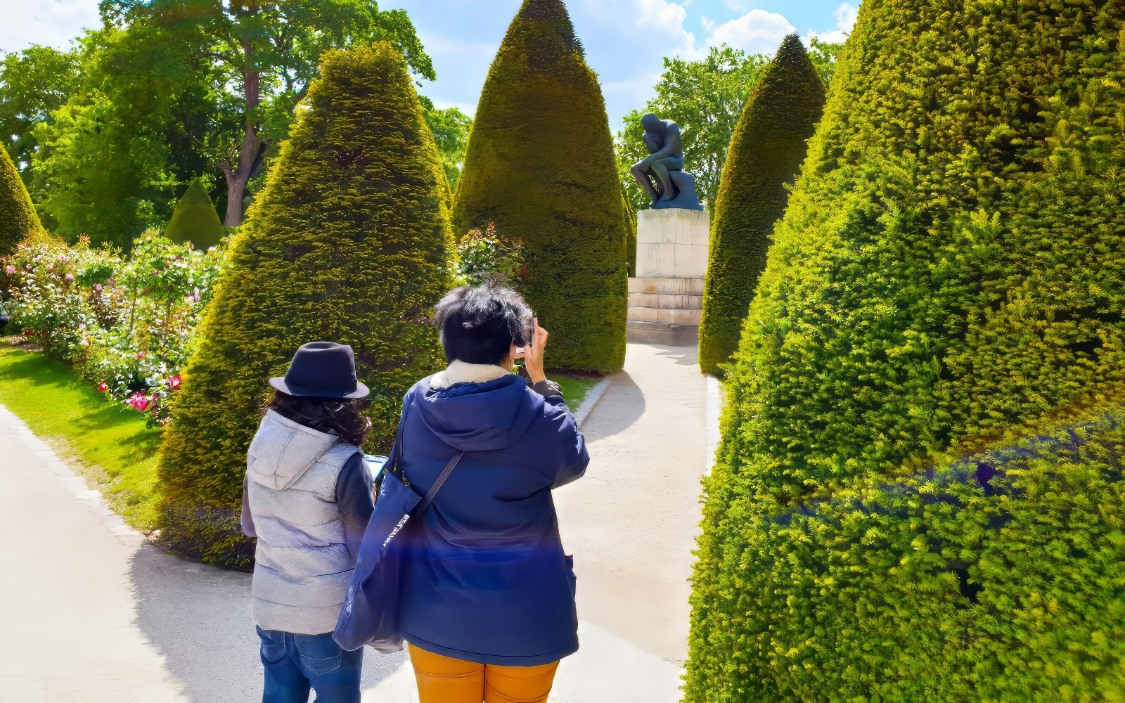Exclusive private guided tour group exploring the Rodin Museum in Paris, admiring the unique sculptures and artwork