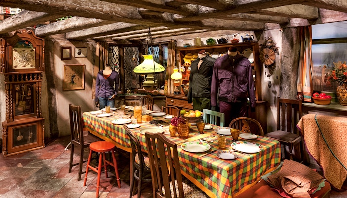 Weasley kitchen exhibit at Harry Potter London tour featuring magical household items.