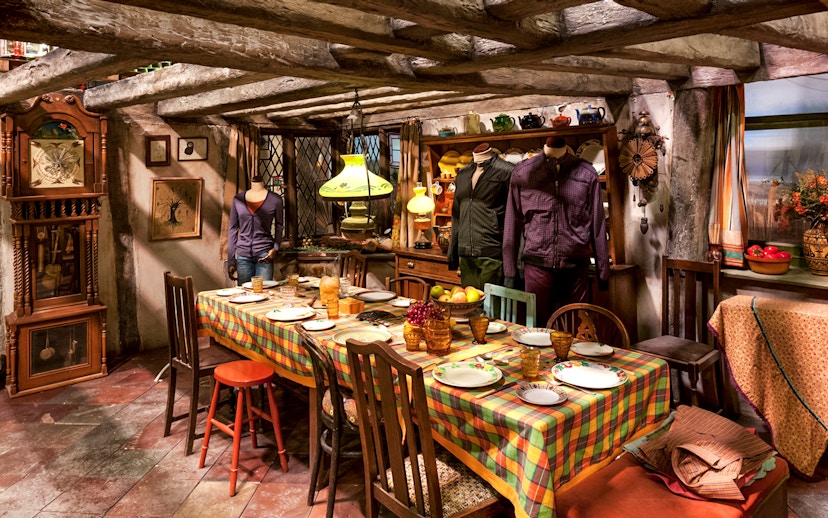 Weasley kitchen exhibit with table setting, part of Harry Potter London tour.