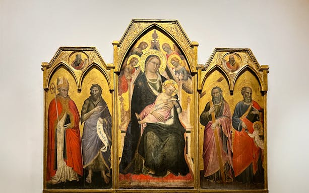 The Enthroned Madonna and Child with Saints by Agnolo Gaddi, featuring religious figures.