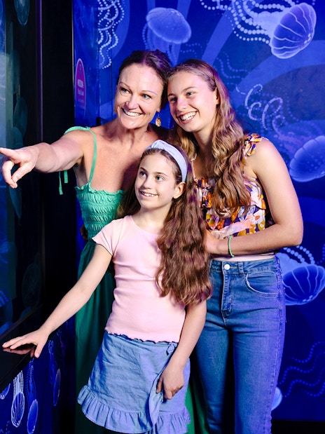 Visitors observing jellyfish at the Ocean Invaders exhibit, SEA LIFE Melbourne.