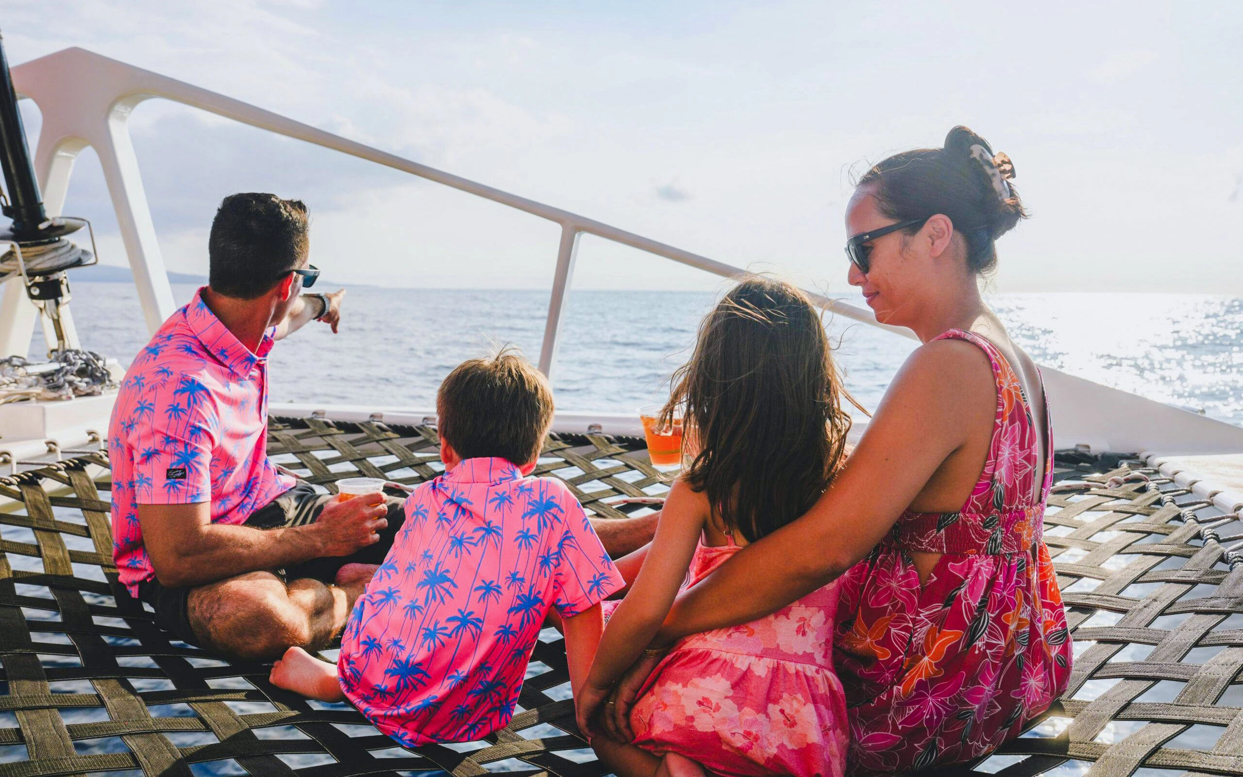 Family enjoying ocean view on Kona Deluxe Whale Watch Sail.