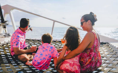 Family enjoying ocean view on Kona Deluxe Whale Watch Sail.
