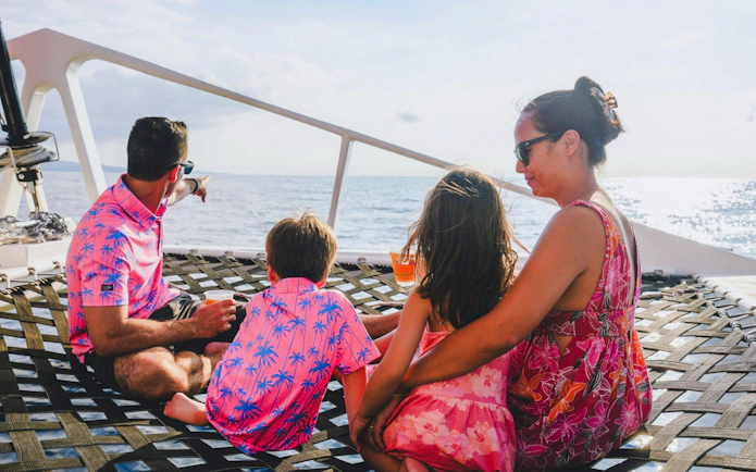 Family enjoying ocean view on Kona Deluxe Whale Watch Sail.
