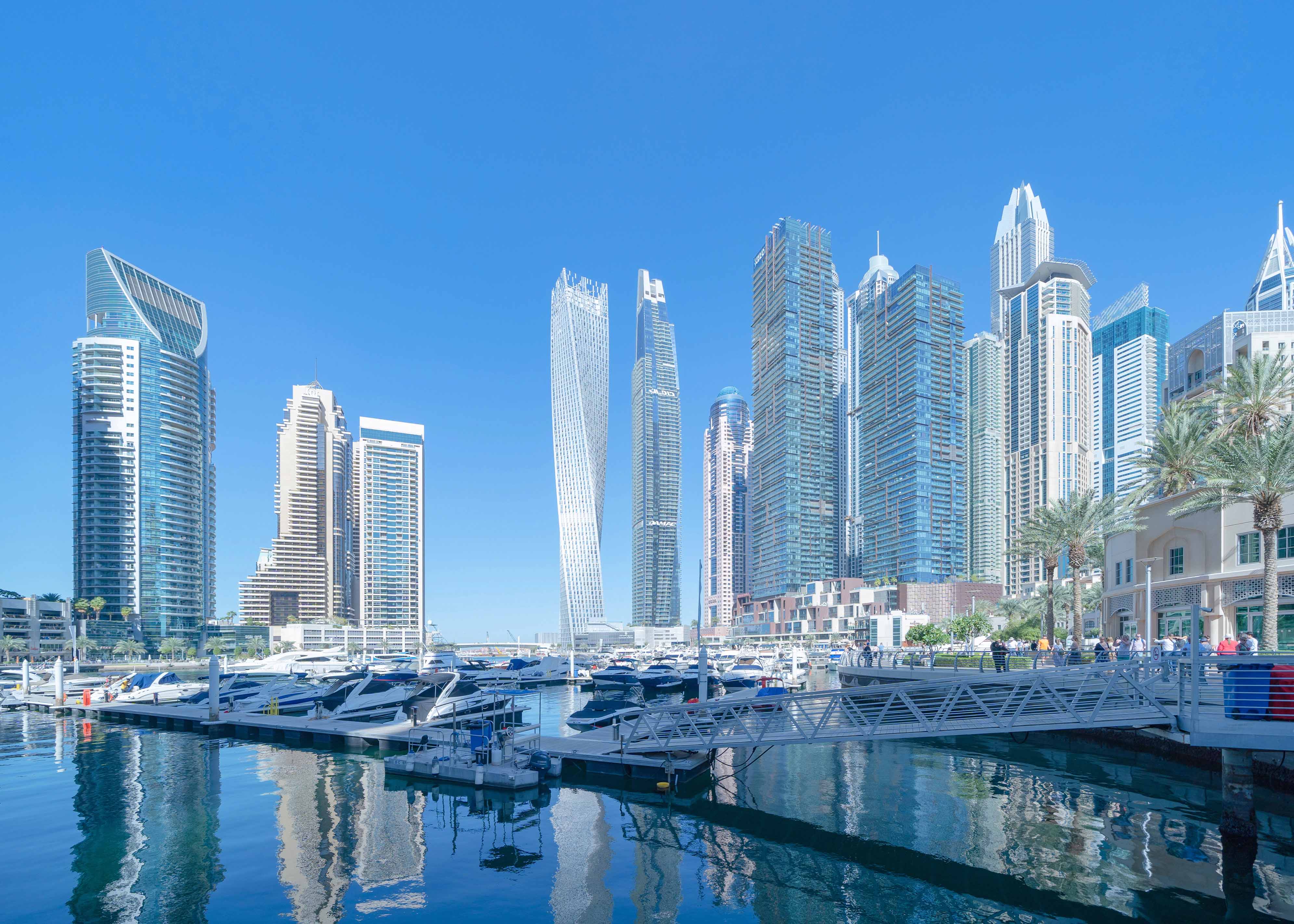 Jumeirah Lakes skyline with modern skyscrapers and serene water reflections in Dubai.