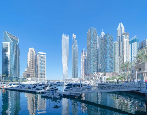 Jumeirah Lakes skyline with modern skyscrapers and serene water reflections in Dubai.