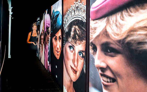 Princess Diana photography exhibition with large portraits on display.