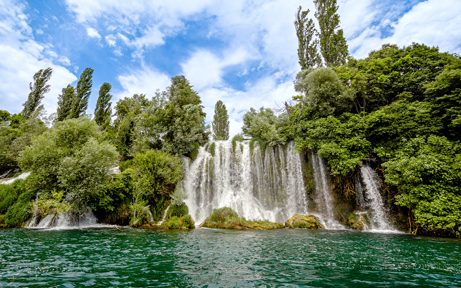 Roski Waterfall cascading over rocks in Krka National Park, Croatia.