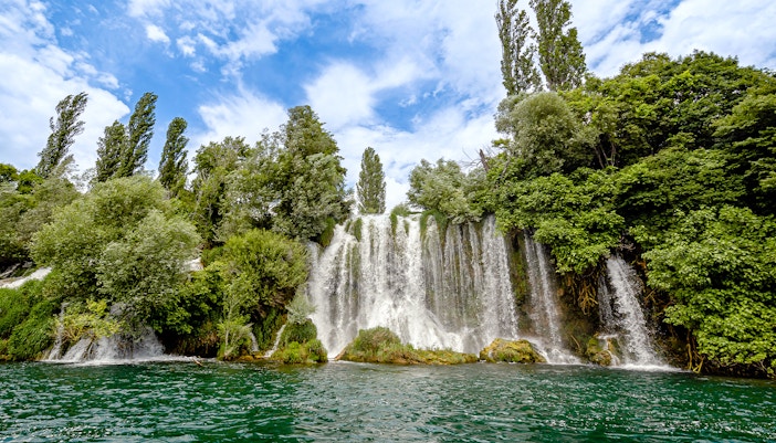 Roski Waterfall cascading over rocks in Krka National Park, Croatia.