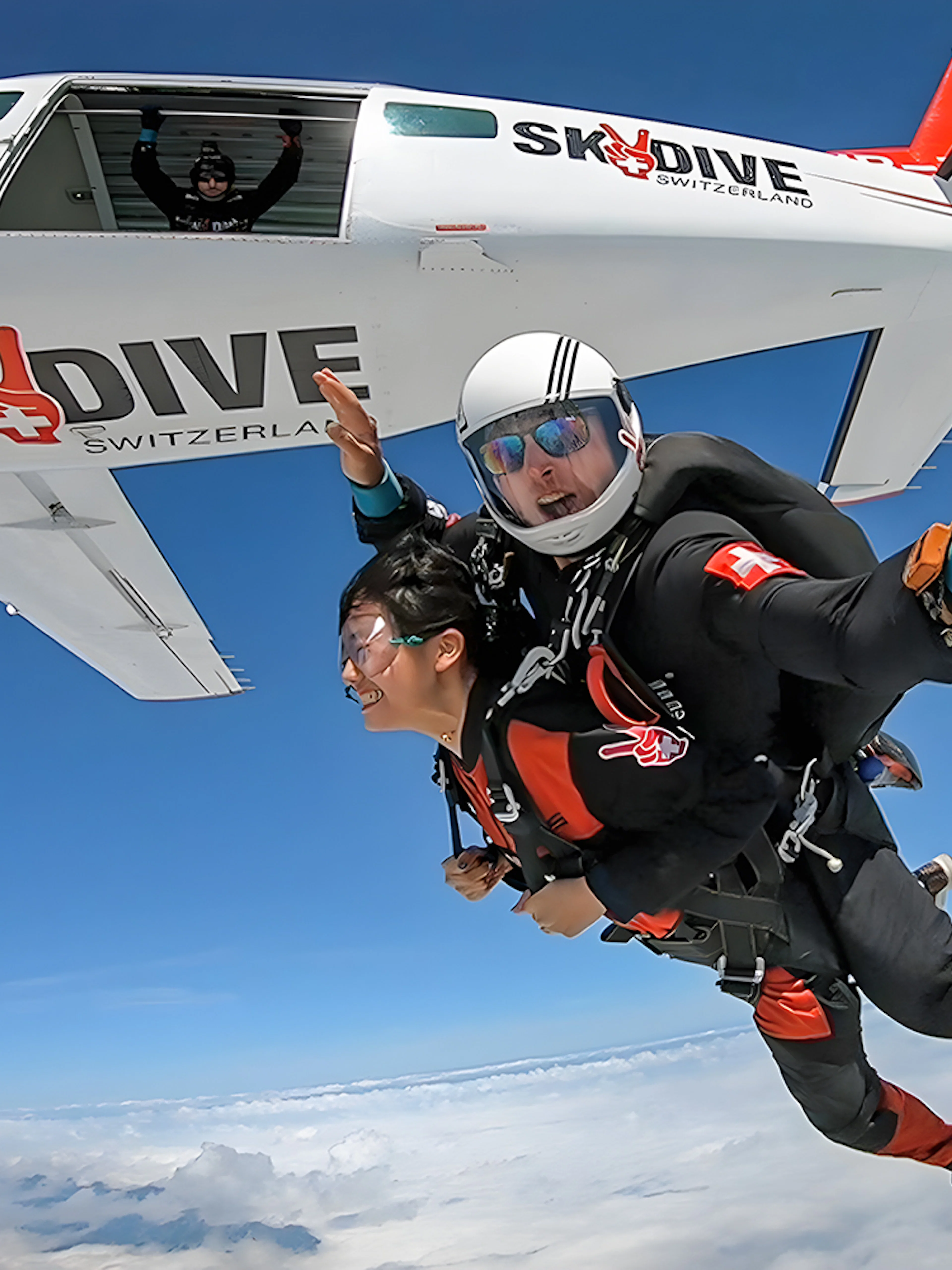 Tandem skydive from plane over Switzerland at 13,000 feet.