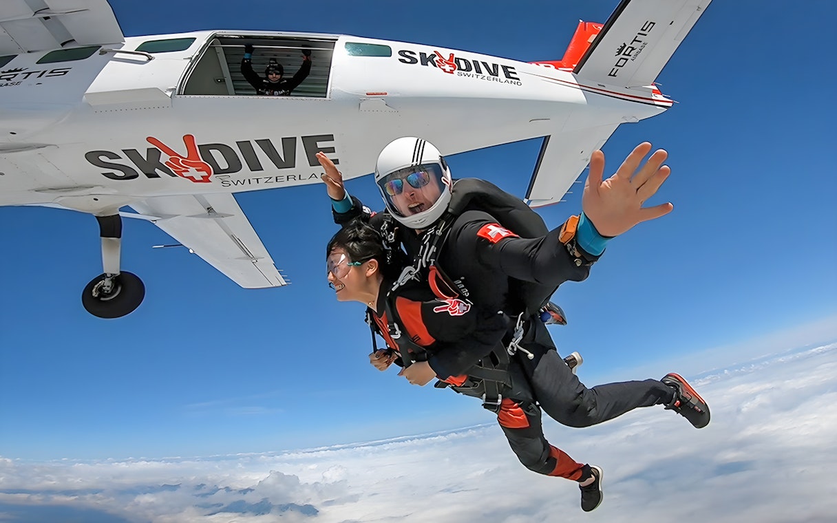 Tandem skydive from plane over Switzerland at 13,000 feet.