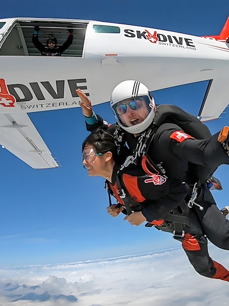 Tandem skydive from plane over Switzerland at 13,000 feet.