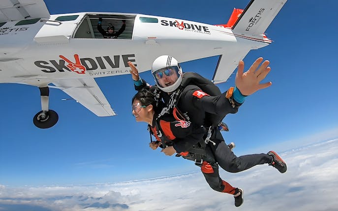Tandem skydive from plane over Switzerland at 13,000 feet.