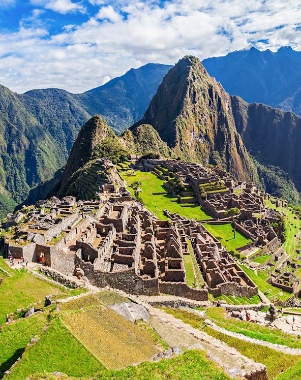 Machu Picchu ruins with Huayna Picchu mountain in the background, Peru.