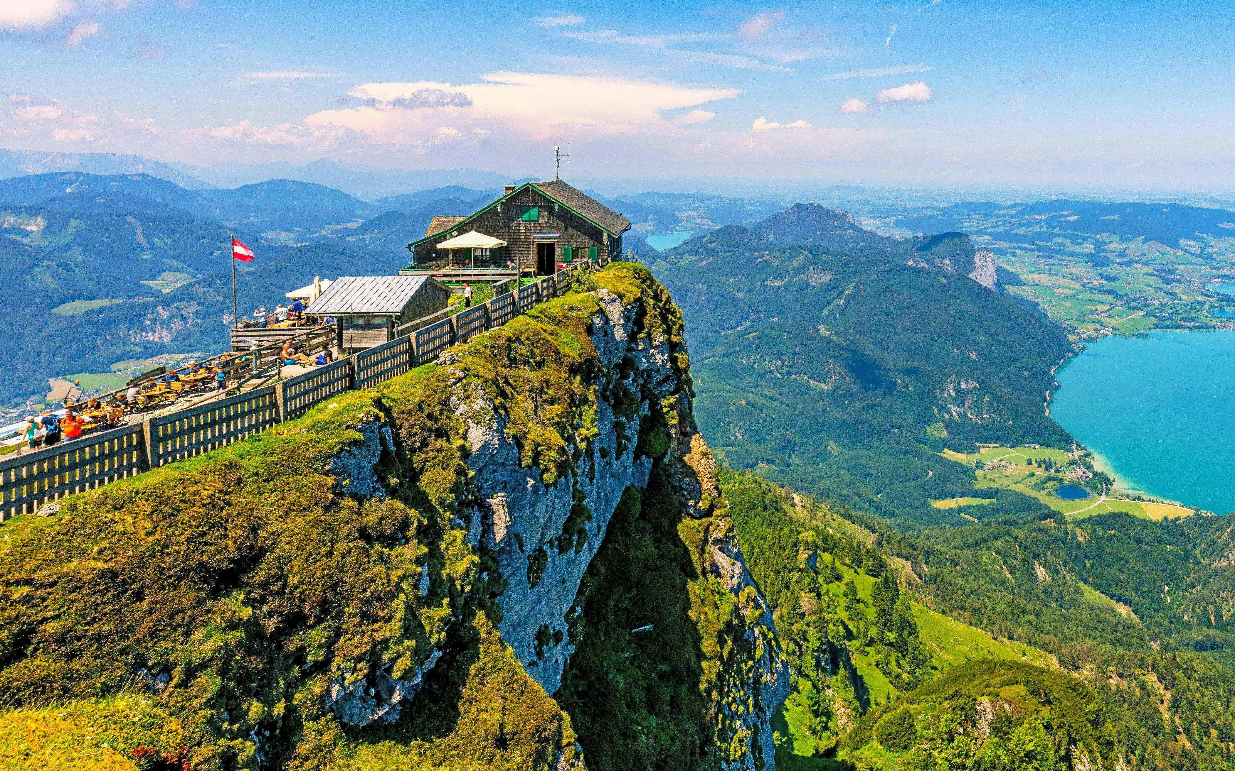 Mountain hut on Schafberg peak overlooking Salzkammergut lakes, Hallstatt, Austria.