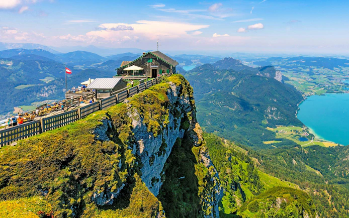 Mountain hut on Schafberg peak overlooking Salzkammergut lakes, Hallstatt, Austria.