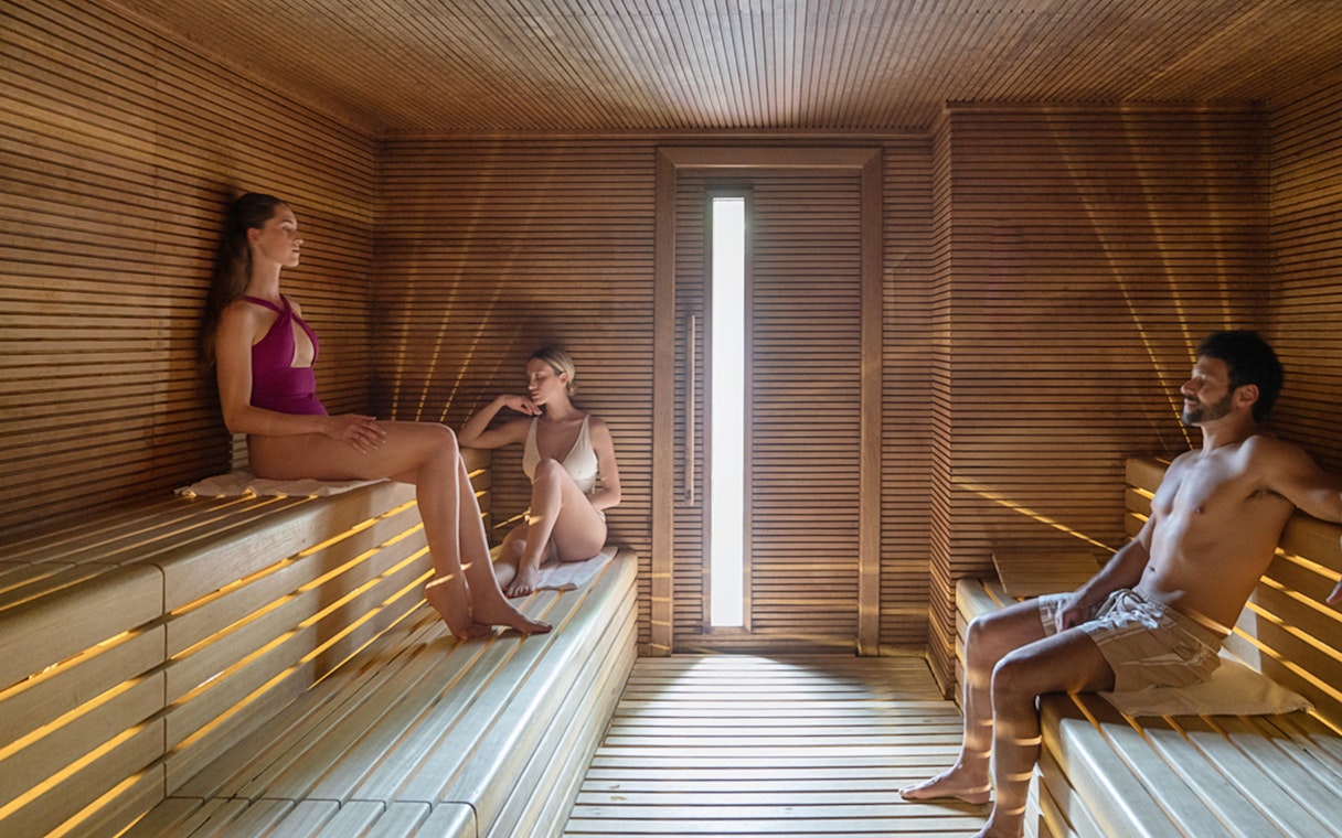 Visitors relaxing in the sauna at QC TermeTorino Spa, Italy.