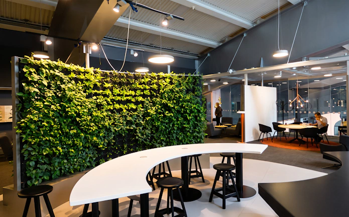 Pearl Lounge seating area with green wall at Stockholm Arlanda Airport Terminal 2.