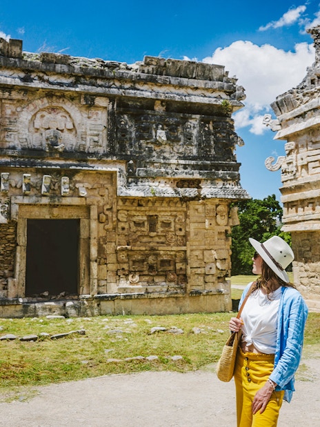 Tourist exploring ancient ruins at Chichen Itza, Yucatan.