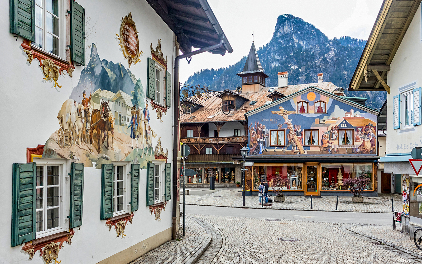 Street view in Bavarian village with painted murals, en route to Linderhof and Neuschwanstein castles from Munich.