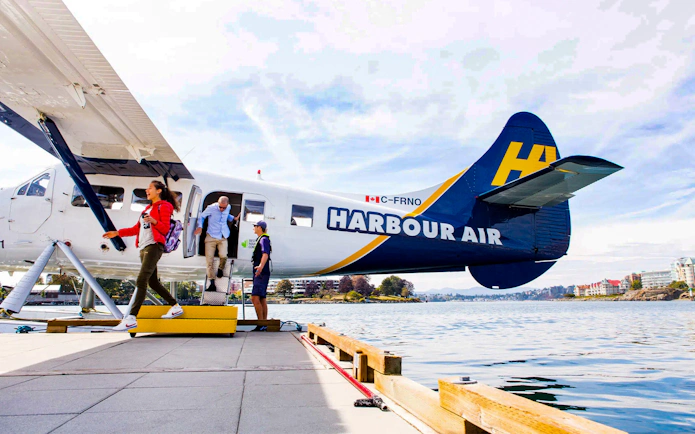 People exiting Harbour Air seaplane after Victoria Panorama Scenic Tour.