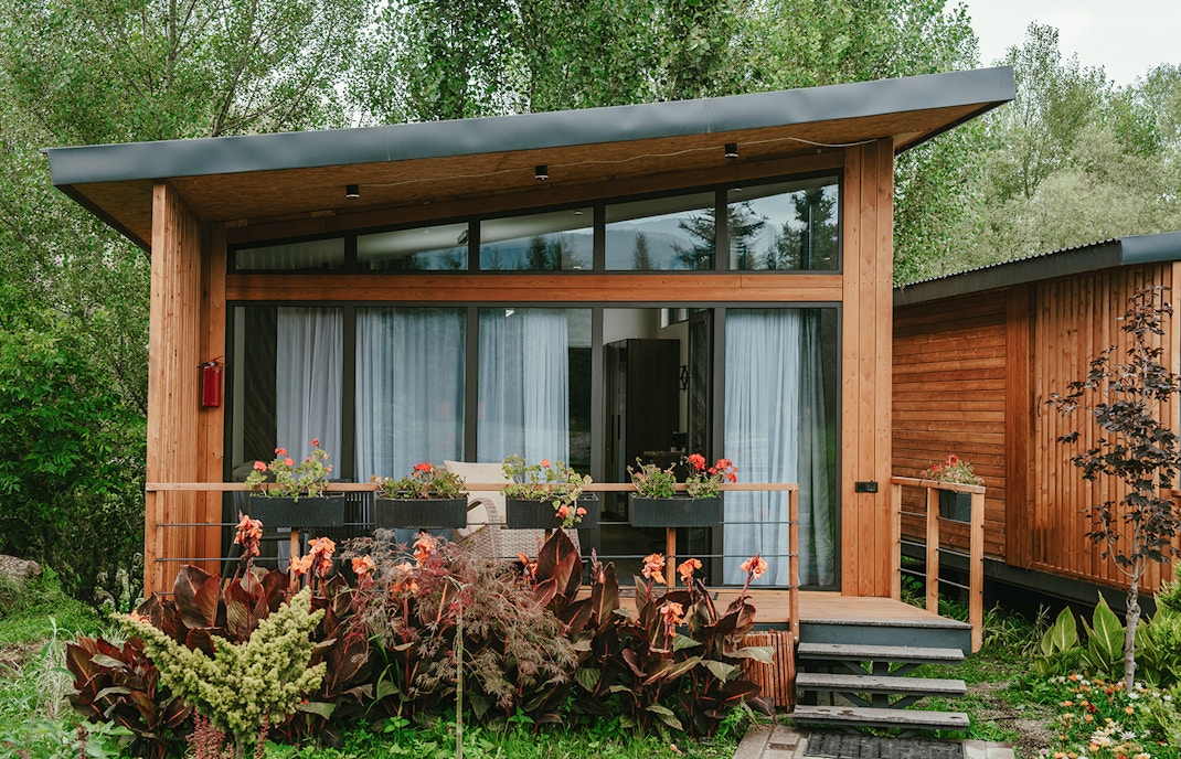 Wooden modern hideaway cabin in the forest