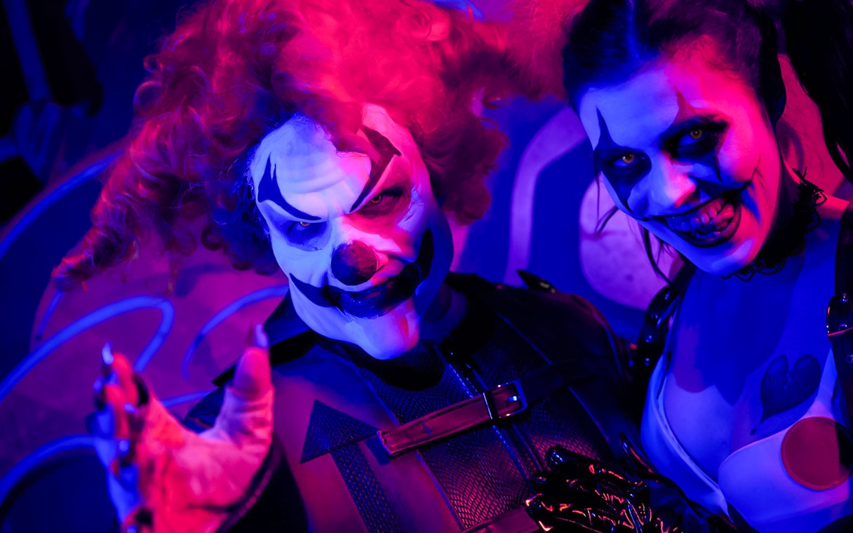 Clowns in eerie makeup at Las Vegas: Universal Horror Unleashed event.