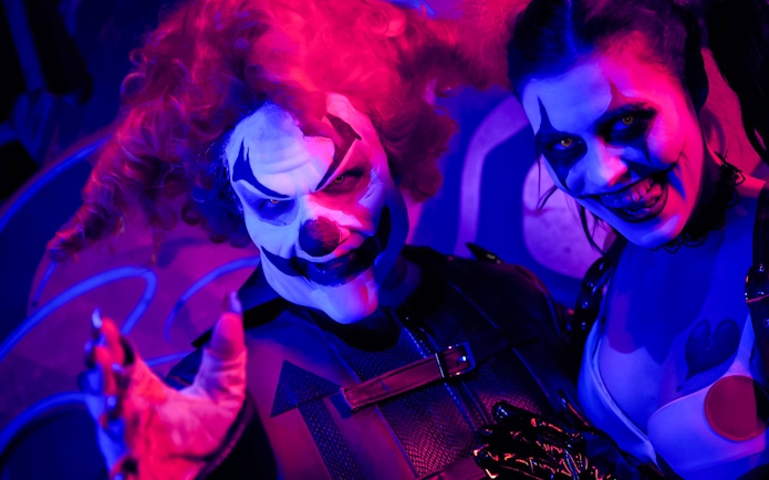 Clowns in eerie makeup at Las Vegas: Universal Horror Unleashed event.