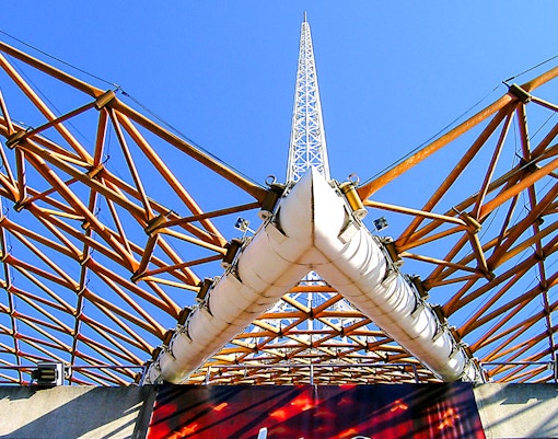 Arts Centre Melbourne spire and lattice structure against blue sky.