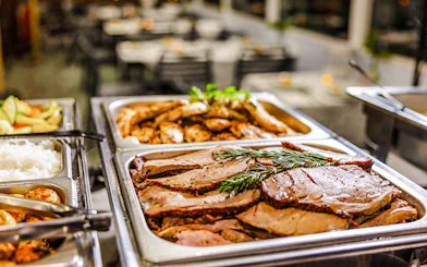 Buffet dinner with roast meats and rice on Gold Coast sightseeing cruise.