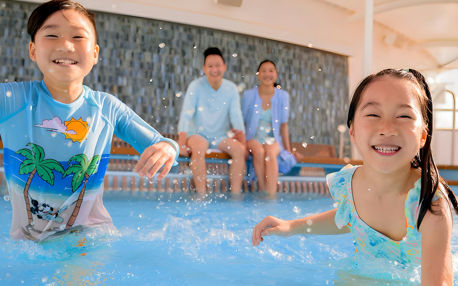 Family enjoying deck activities on Disney Adventure Cruise ship.