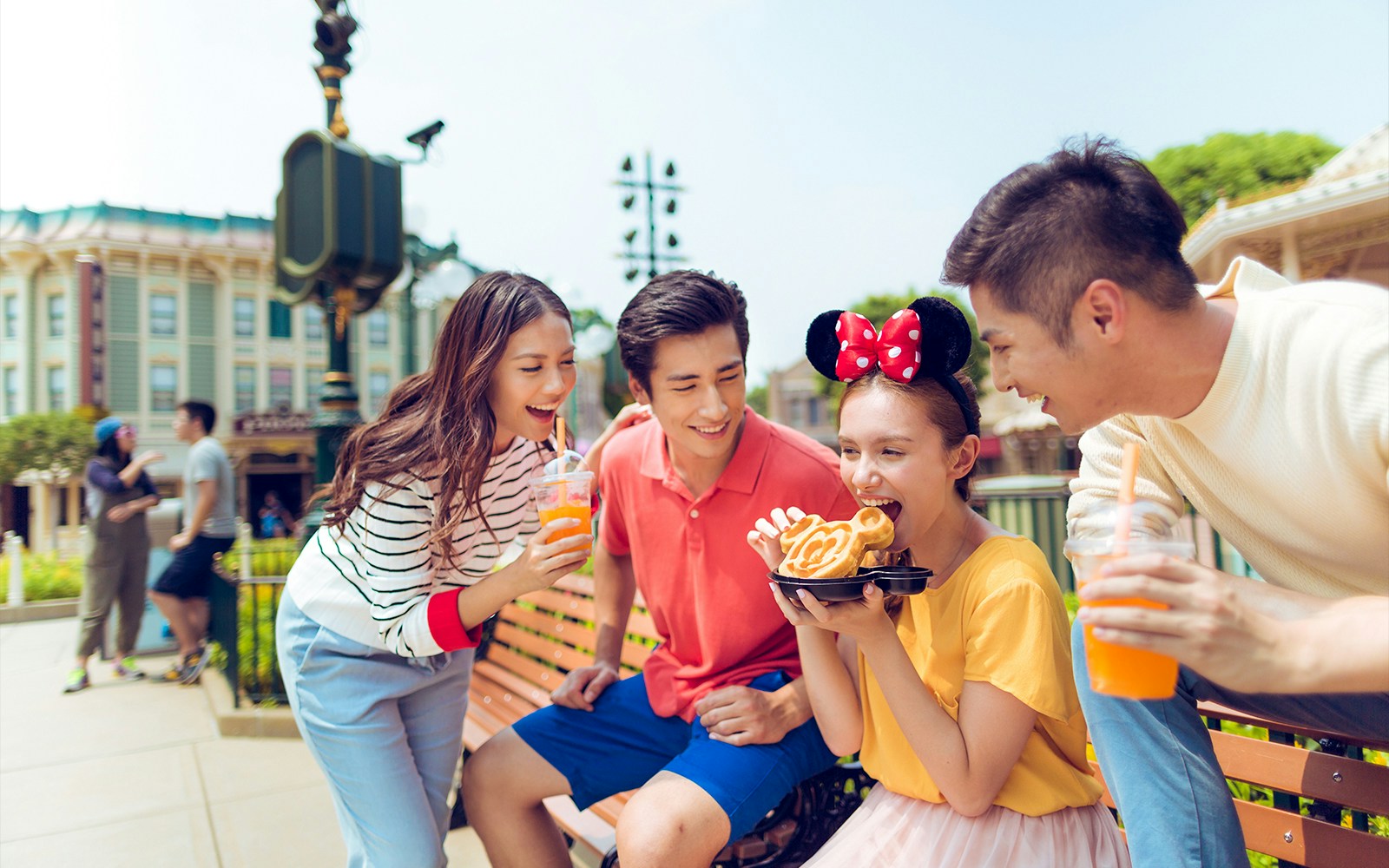Visitors enjoying snacks and drinks at Hong Kong Disneyland with 2-Day Tickets.