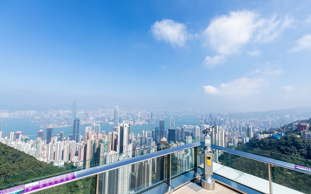 Hong Kong skyline view from Sky Terrace 428 with binoculars and Victoria Harbour.