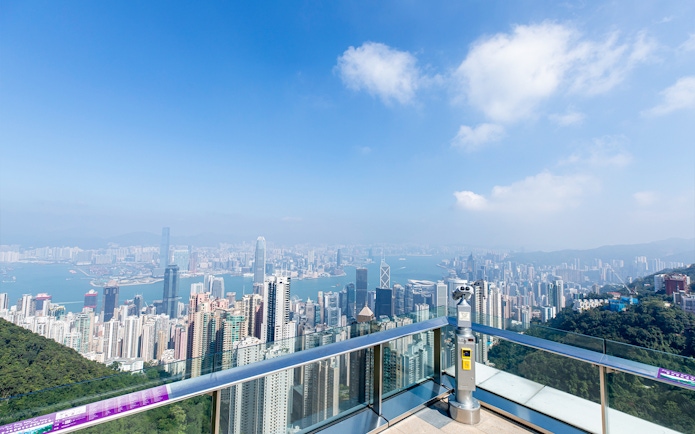 Hong Kong skyline view from Sky Terrace 428 with binoculars and Victoria Harbour.